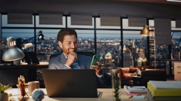 A person talking on the phone while looking at a laptop screen displaying credit card information and interest rates. The background is a modern office space.