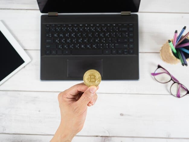 A close-up of a person's hands using a laptop to manage cryptocurrency investments, with a focus on the screen displaying different tax forms related to digital assets.
