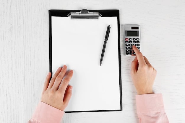 A person's hands filling out a tax form with a calculator and pen on the table. The focus should be on the details of the form, highlighting the importance of accuracy when applying for the Child Tax Credit.