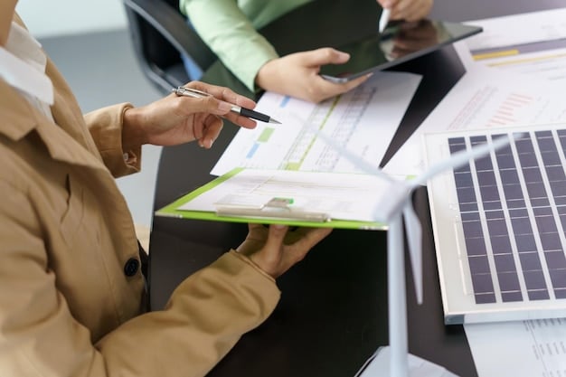 A person reviewing a form with financial documents, representing the application process for energy assistance programs and the importance of meeting eligibility requirements.