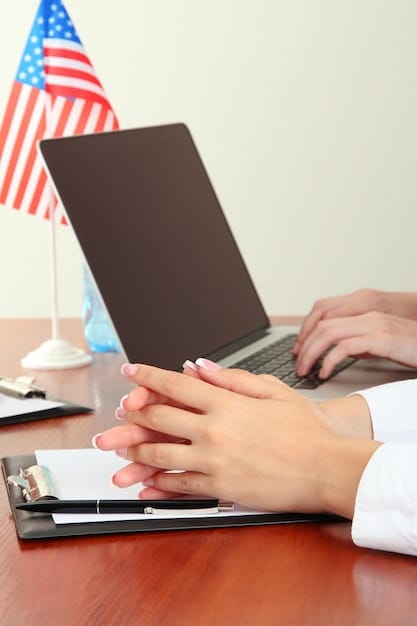 A close-up shot of a person's hands typing on a computer keyboard, with the screen displaying a U.S. government website and various forms related to government services.