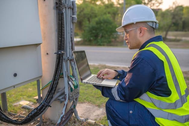 A worker installing fiber optic cables underground in a suburban area, highlighting the expansion of high-speed internet access and the development of broadband infrastructure in the United States.