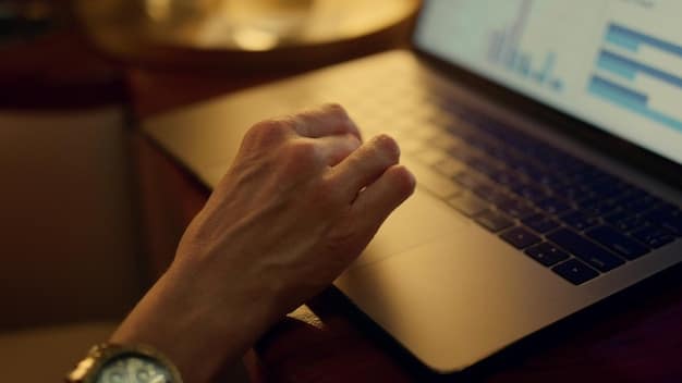 A close-up shot of a financial analyst's hands typing on a laptop, with a blurred background of a modern office and multiple monitors displaying stock charts and financial data. Emphasis on the focused and research-oriented nature of the analyst's work.