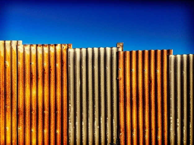 A close-up of shipping containers stacked at a busy port, illustrating supply chain congestion and its impact on inflation.