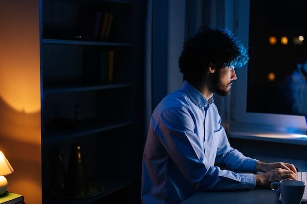 A stock image of a person working on a computer in a darkened room, surrounded by multiple monitors displaying lines of code and security alerts, symbolizing the constant vigilance required in cybersecurity.